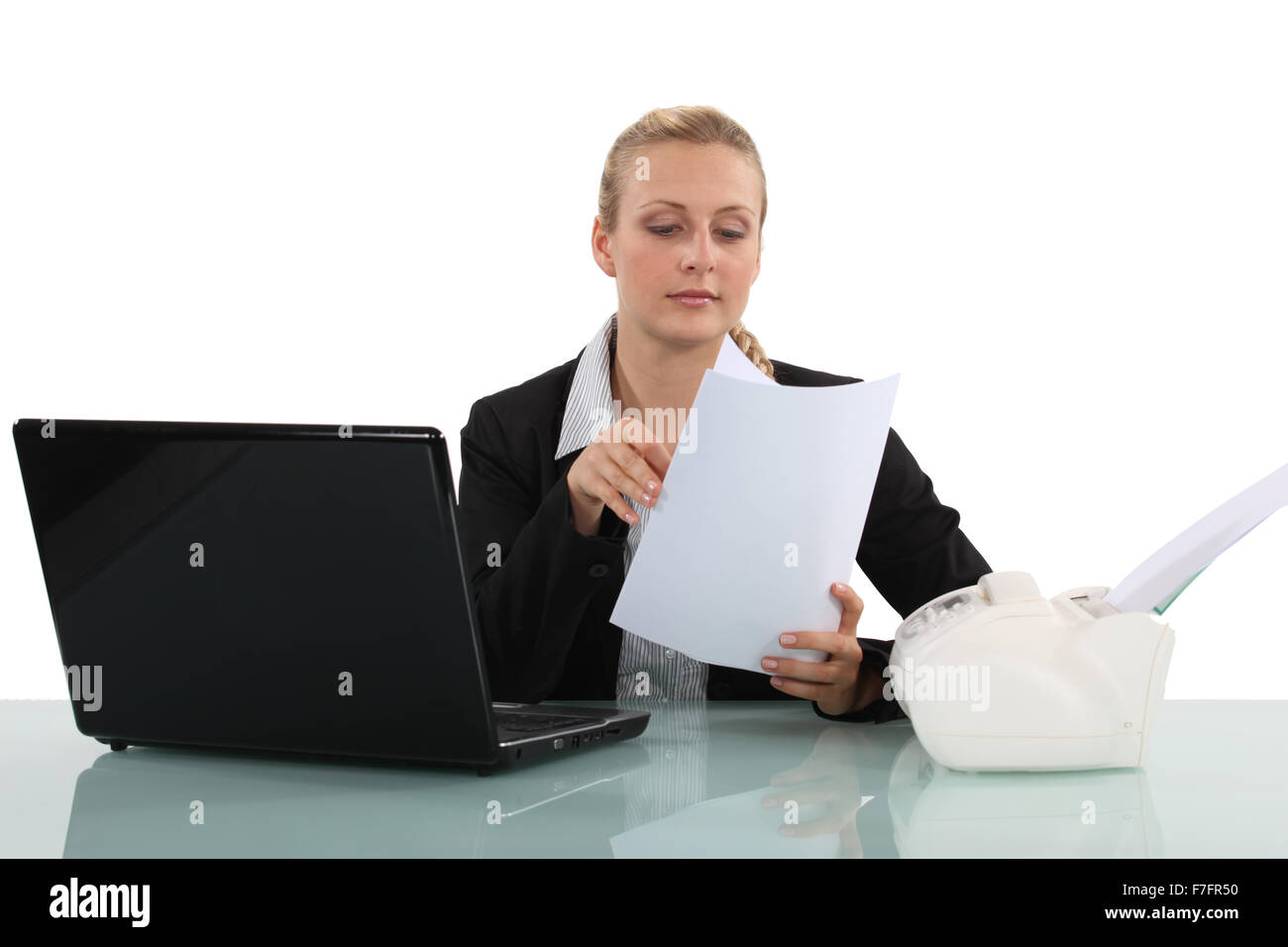 Clerical worker flipping through a document Stock Photo