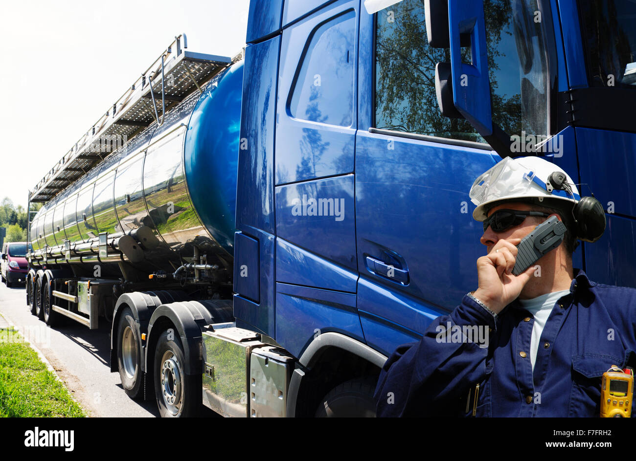 oil and gas truck with driver talking in phone Stock Photo
