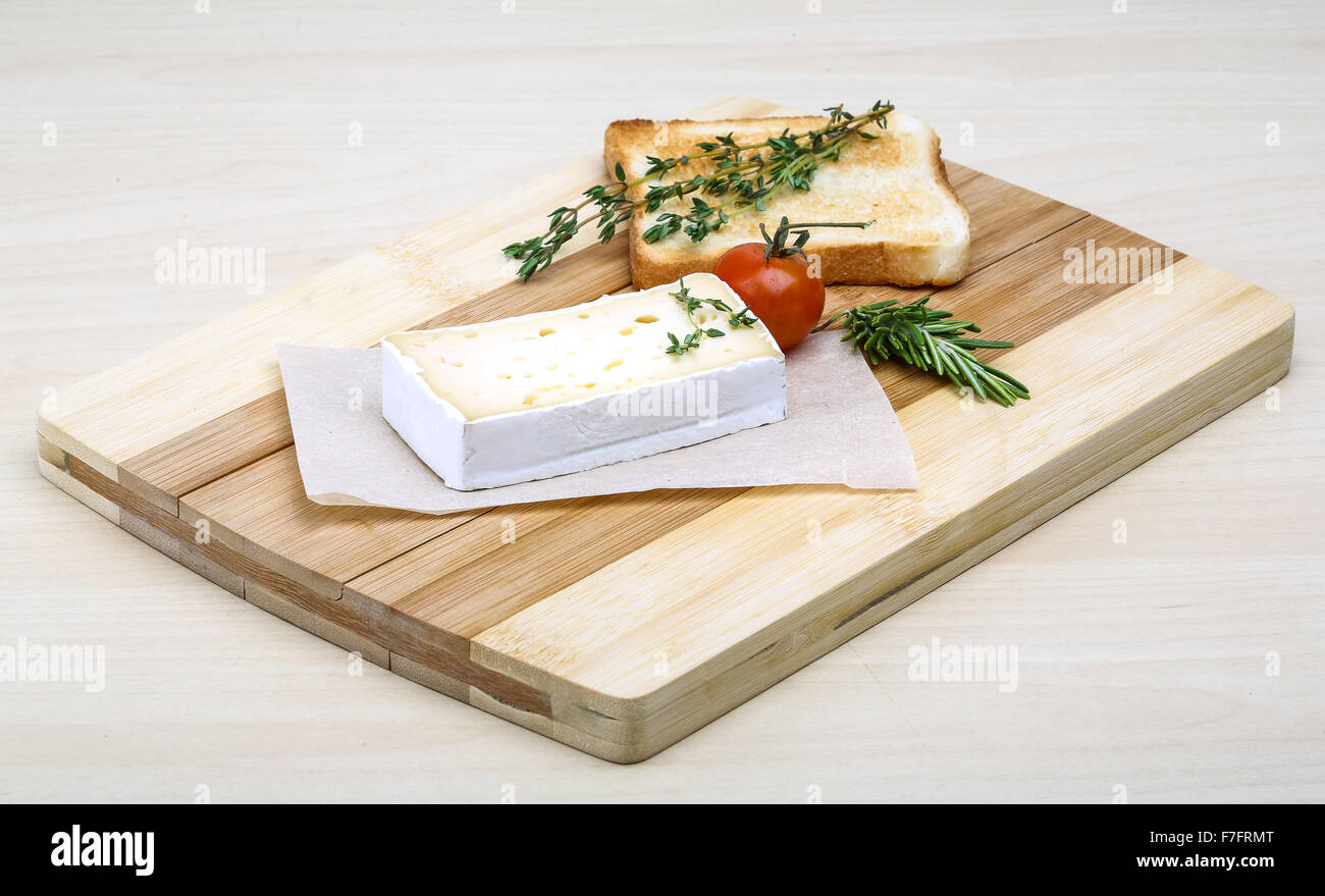Soft brie cheese with rosemary, thyme and toast bread Stock Photo Alamy