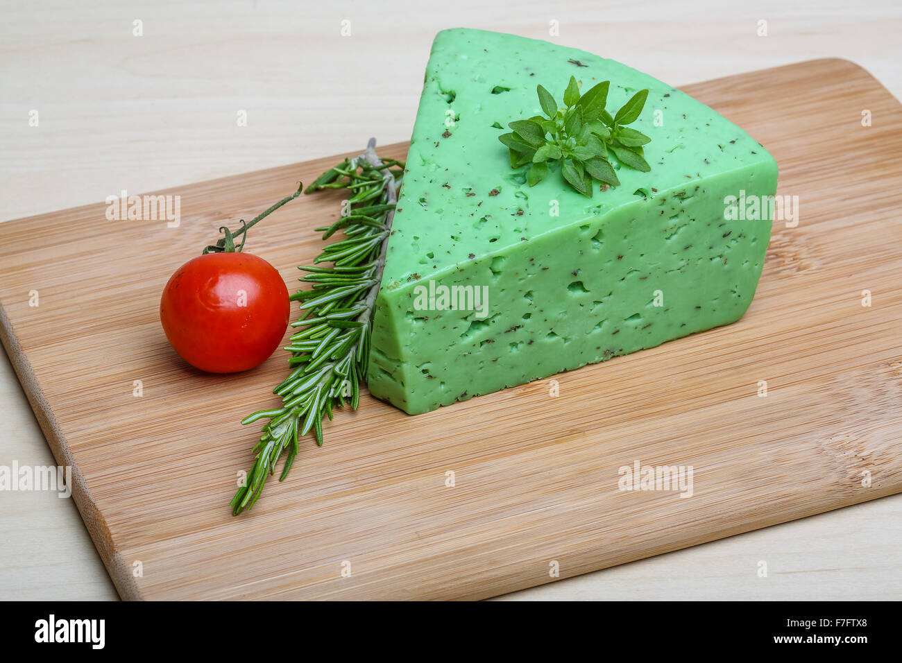 Green pesto cheese with rosemary basil leaves Stock Photo Alamy
