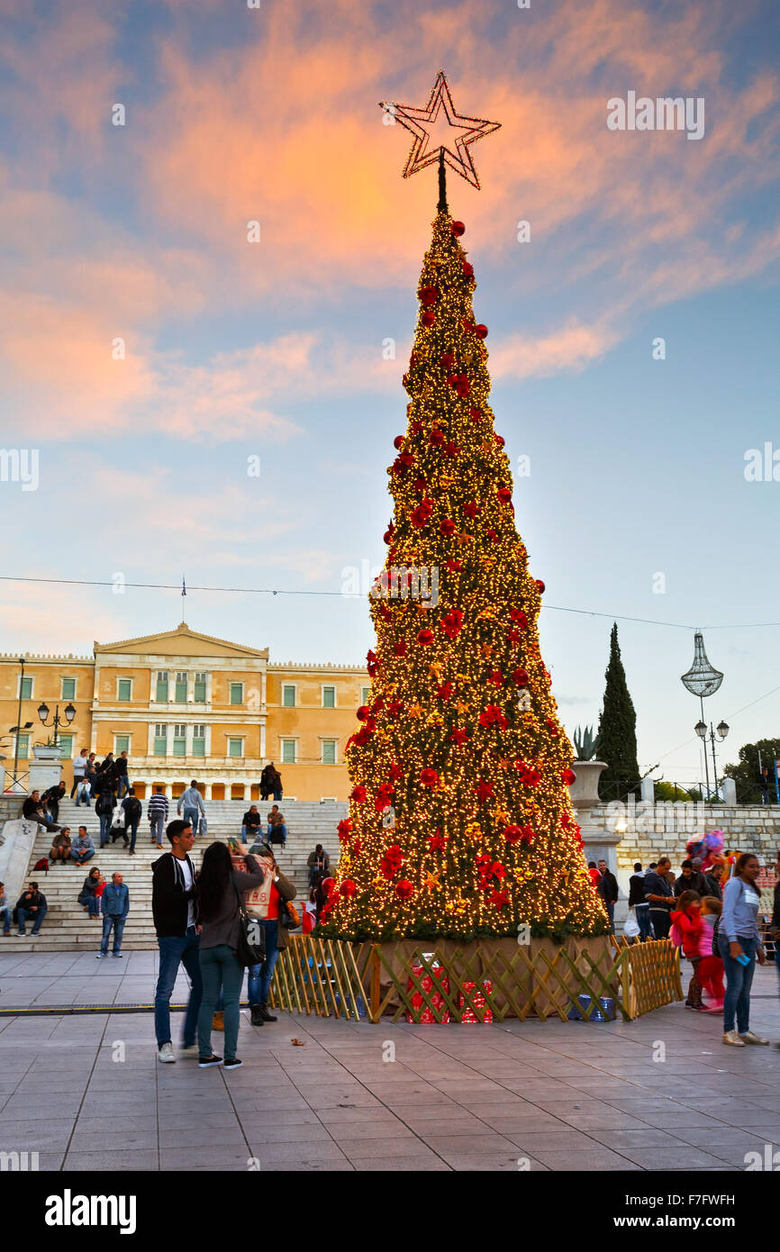 People at a christmas tree in front of Greek parliament in Syntagma square in Athens during the advent Stock Photo