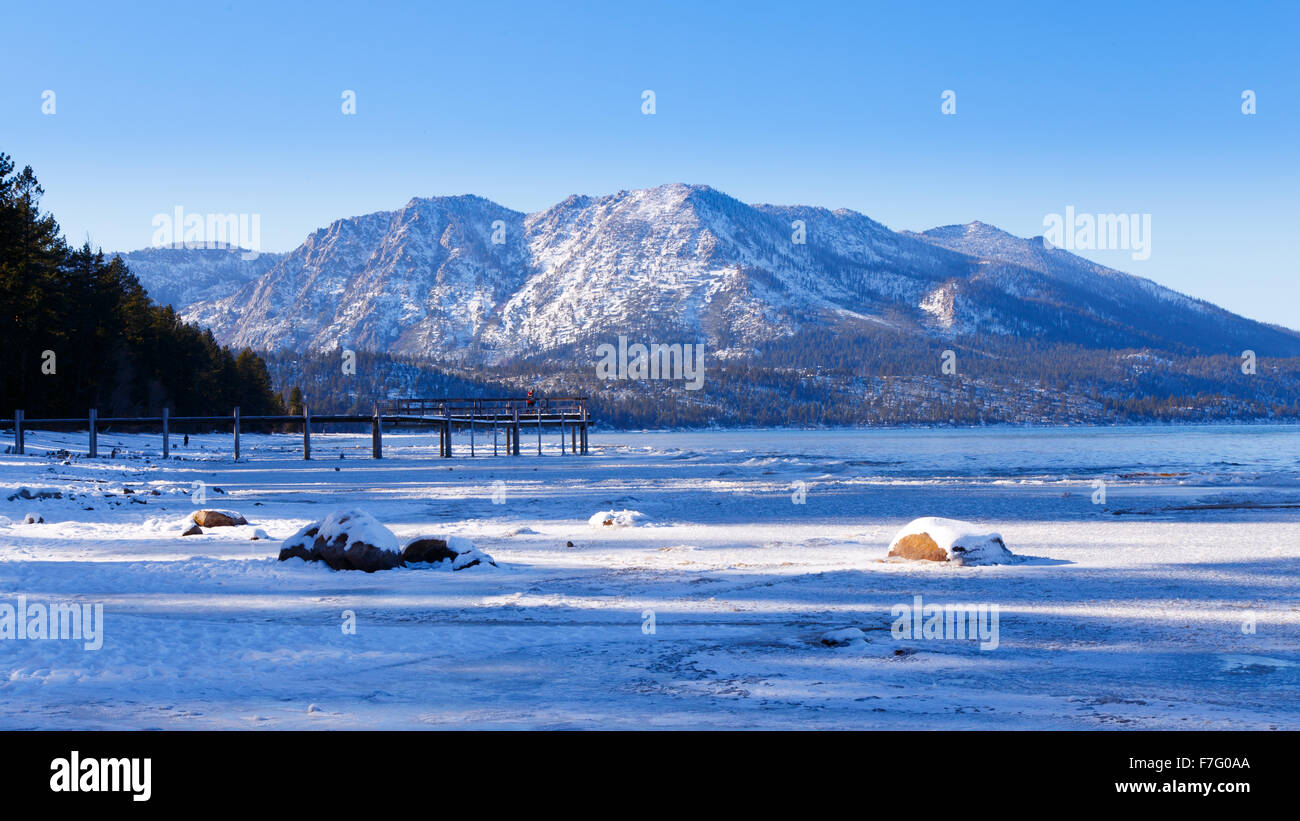Snow covered mountains at Camp Richardson Beach, South Lake Tahoe, CA Stock Photo
