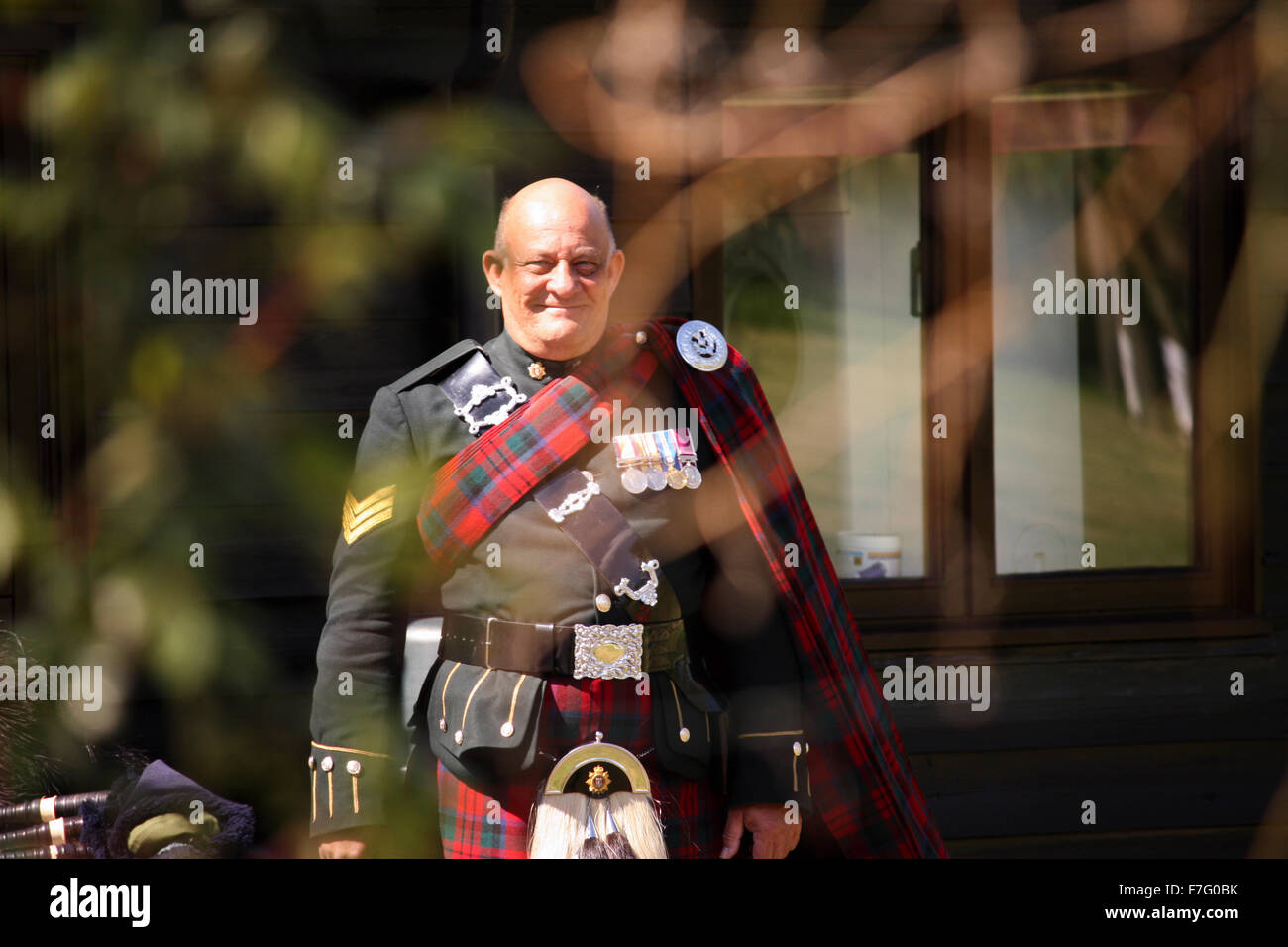 A bagpiper playing bagpipes at a wedding Stock Photo Alamy