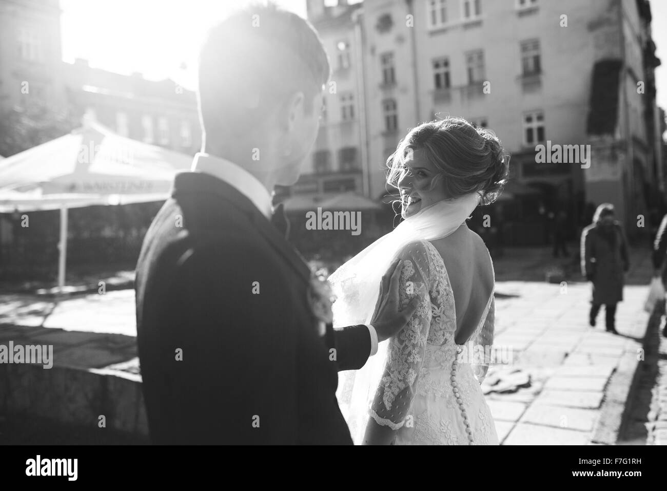 bride and groom posing on the streets Stock Photo - Alamy