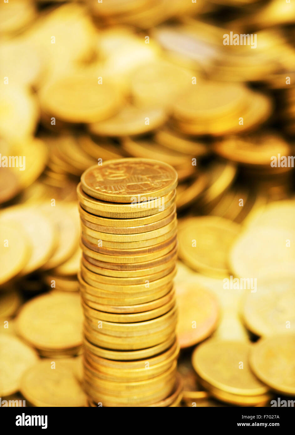 Stack of golden coins isolated on white Stock Photo - Alamy
