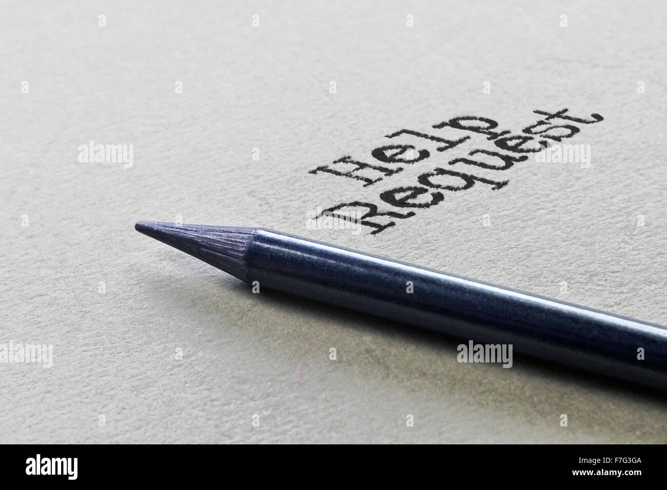 Graphite pencil and handwritten text Help Request Stock Photo