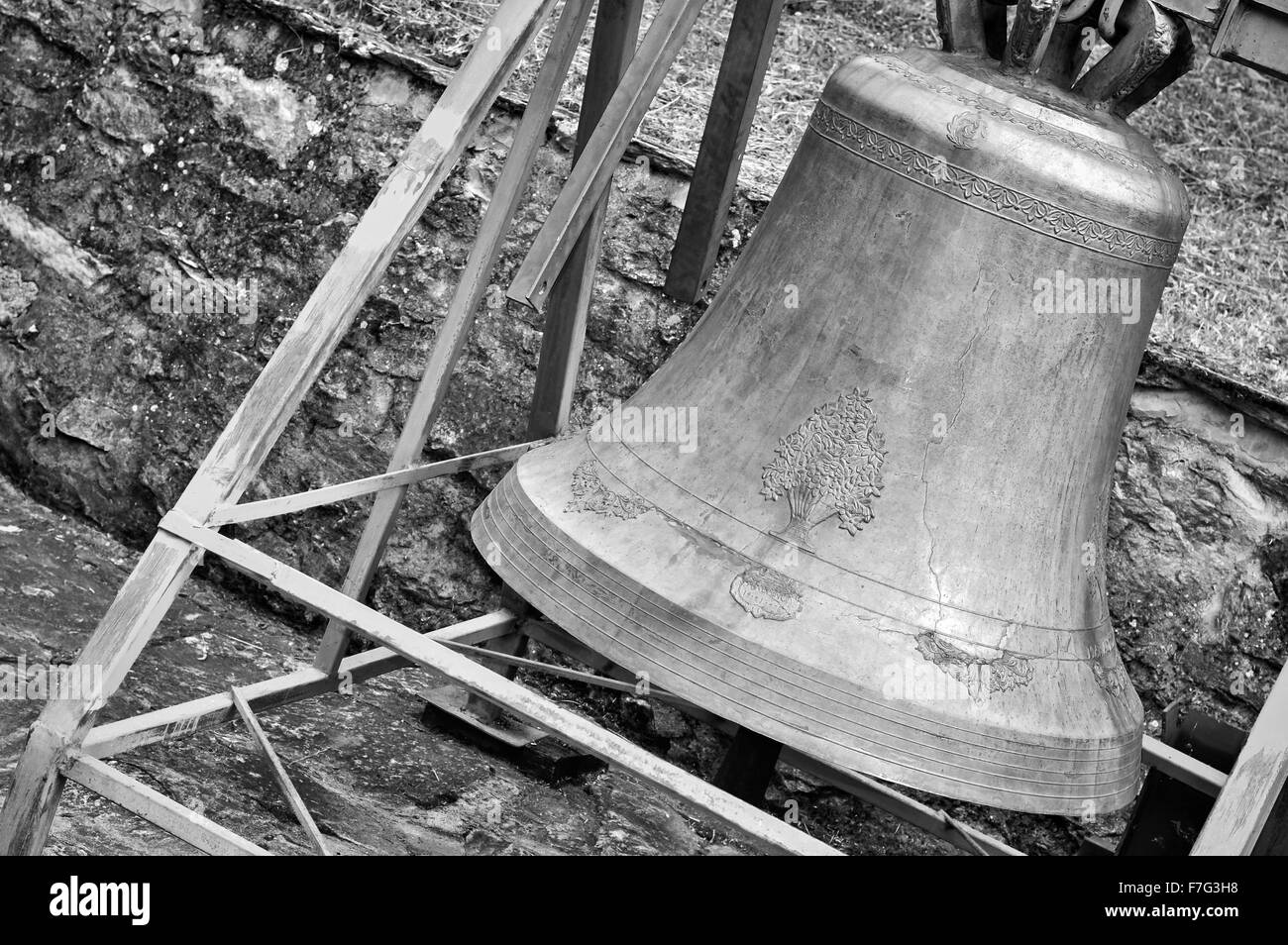 Old brass church bell with ornaments in black and white colors Stock
