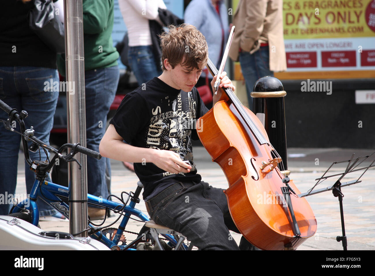 Busker with a cello in Canterbury, England Stock Photo