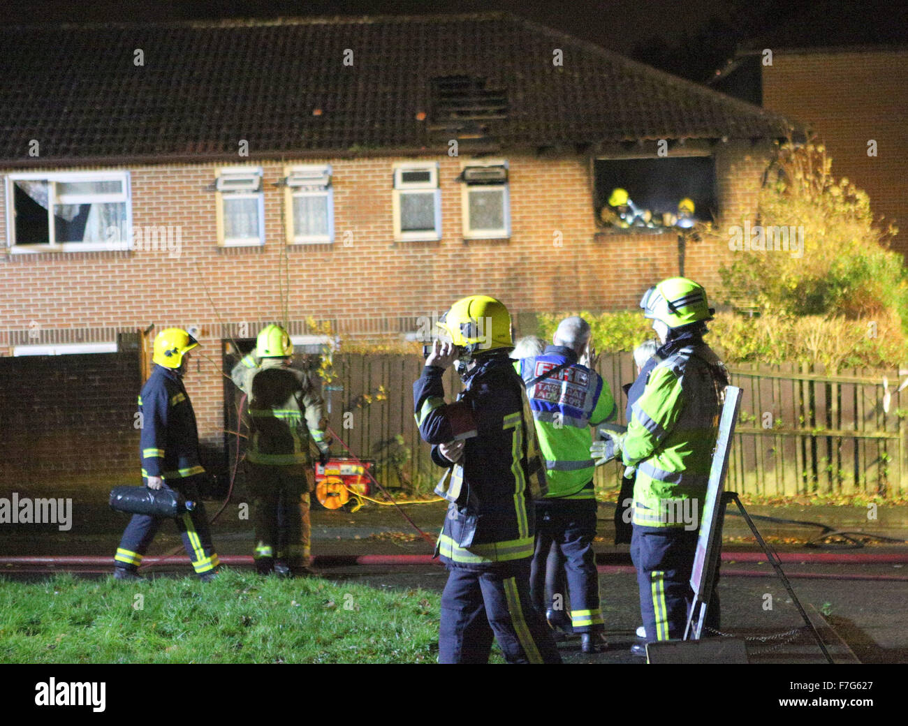 Waterlooville, Hampshire, UK. 30th November, 2015. A faulty phone  charger is believed to have caused the fire that gutted one Waterlooville  home and damaged the roof and other part of another.  The fire started at about 3.45pm and crews from Havant, Portchester and Cosham were called to tackle the  blaze.  A Further crew from Southsea also attended and supported with the clear up operation.  The Home owner who  was home alone at the time had a working smoke alarm that alerted her to the fact that her bedroom was on fire. Credit:  uknip/Alamy Live News Stock Photo