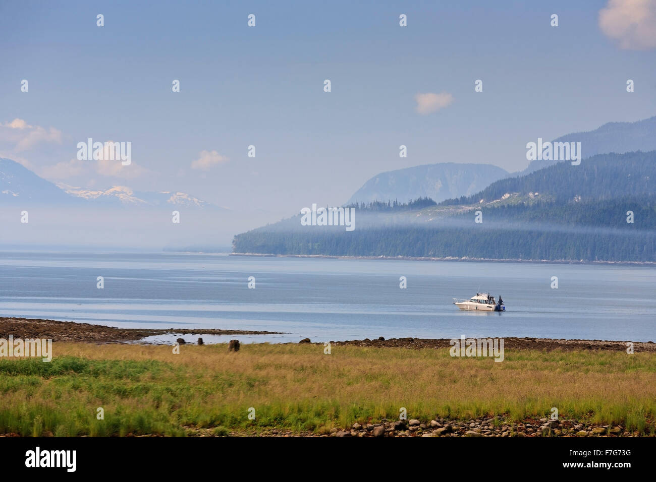 Boat salmon fishing in Douglas Channel by Kitimaat Village, Kitimat, British Columbia Stock Photo