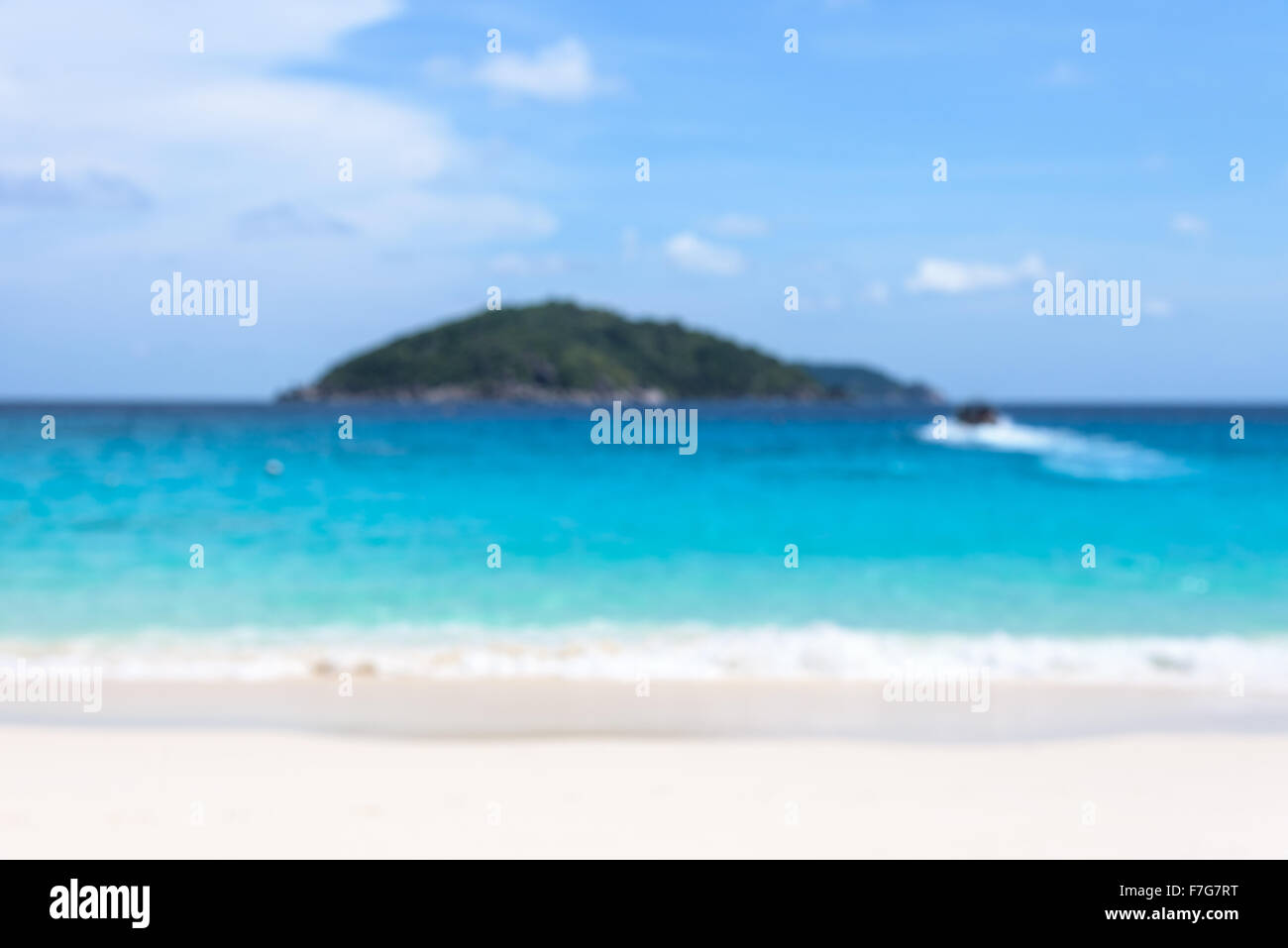 Blur for background beautiful landscapes blue sea beach island and the return journey by boat of tourists under sky in summer Stock Photo
