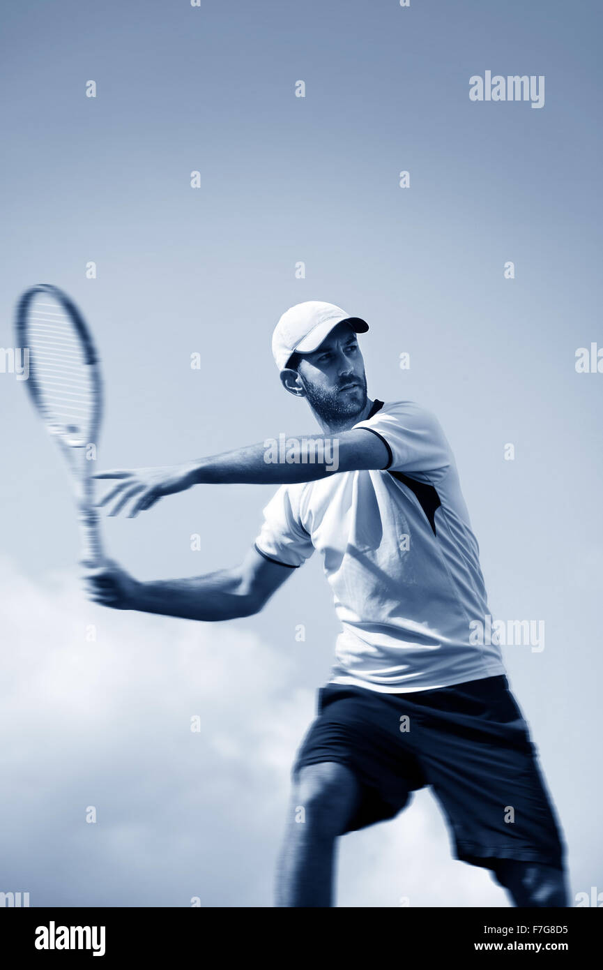 male tennis player in action Stock Photo