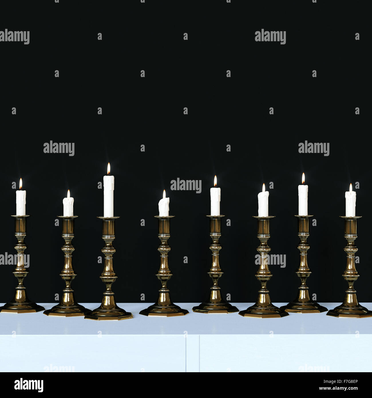 Burning candles in a vintage golden candlesticks. 3d render Stock Photo