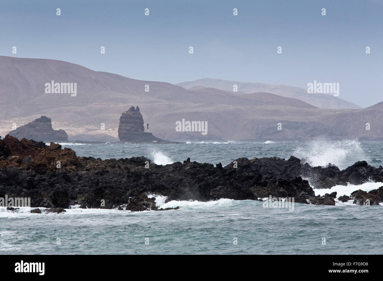 Coast north of Orzola, with eroded lava flows and pinnacles, Lanzarote. Stock Photo