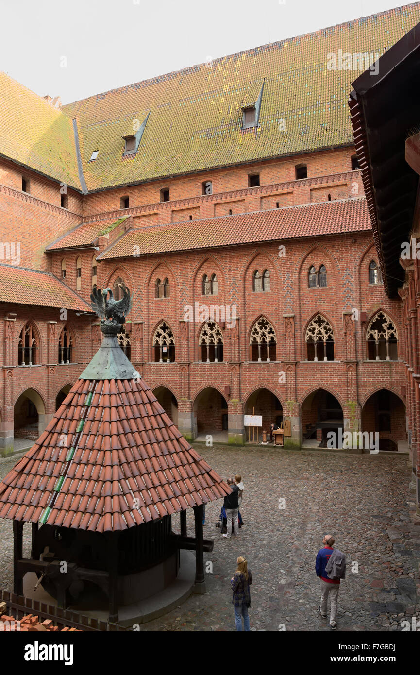 Yard with arcades and galleries in the medieval Castle of the Teutonic Order in Malbork (Marienburg), Poland. Stock Photo