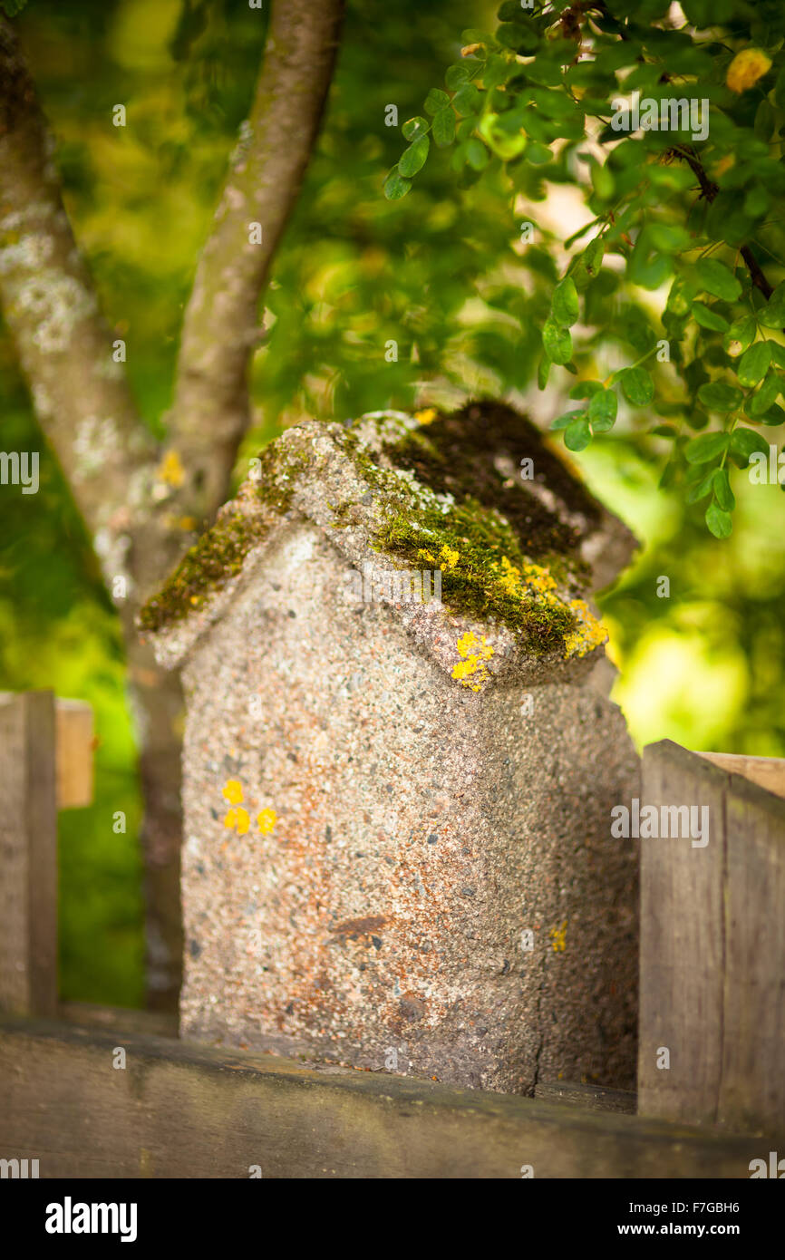 Stone fence and blurred forest background Stock Photo - Alamy