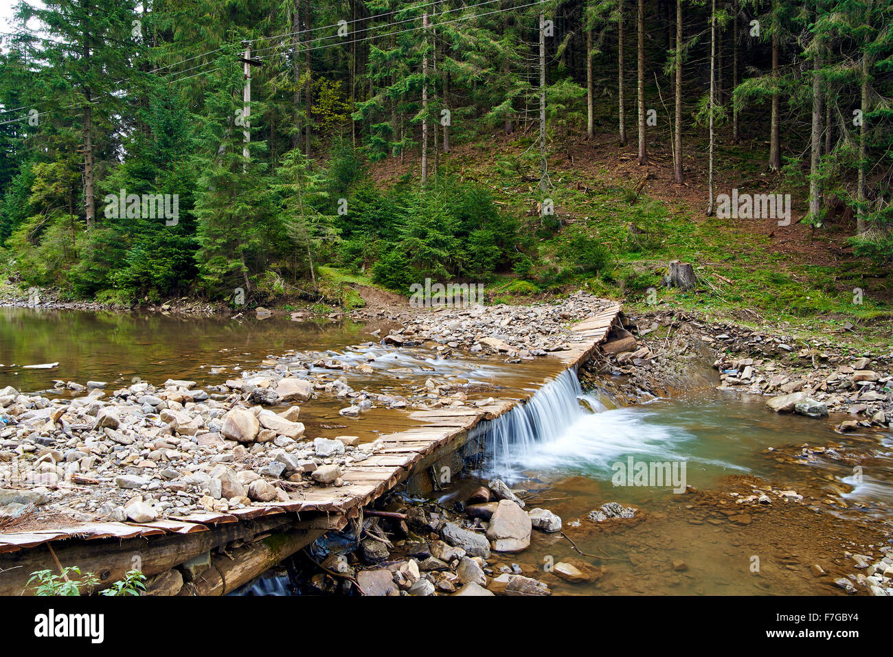 Mountain river in forest with small waterfall Stock Photo - Alamy