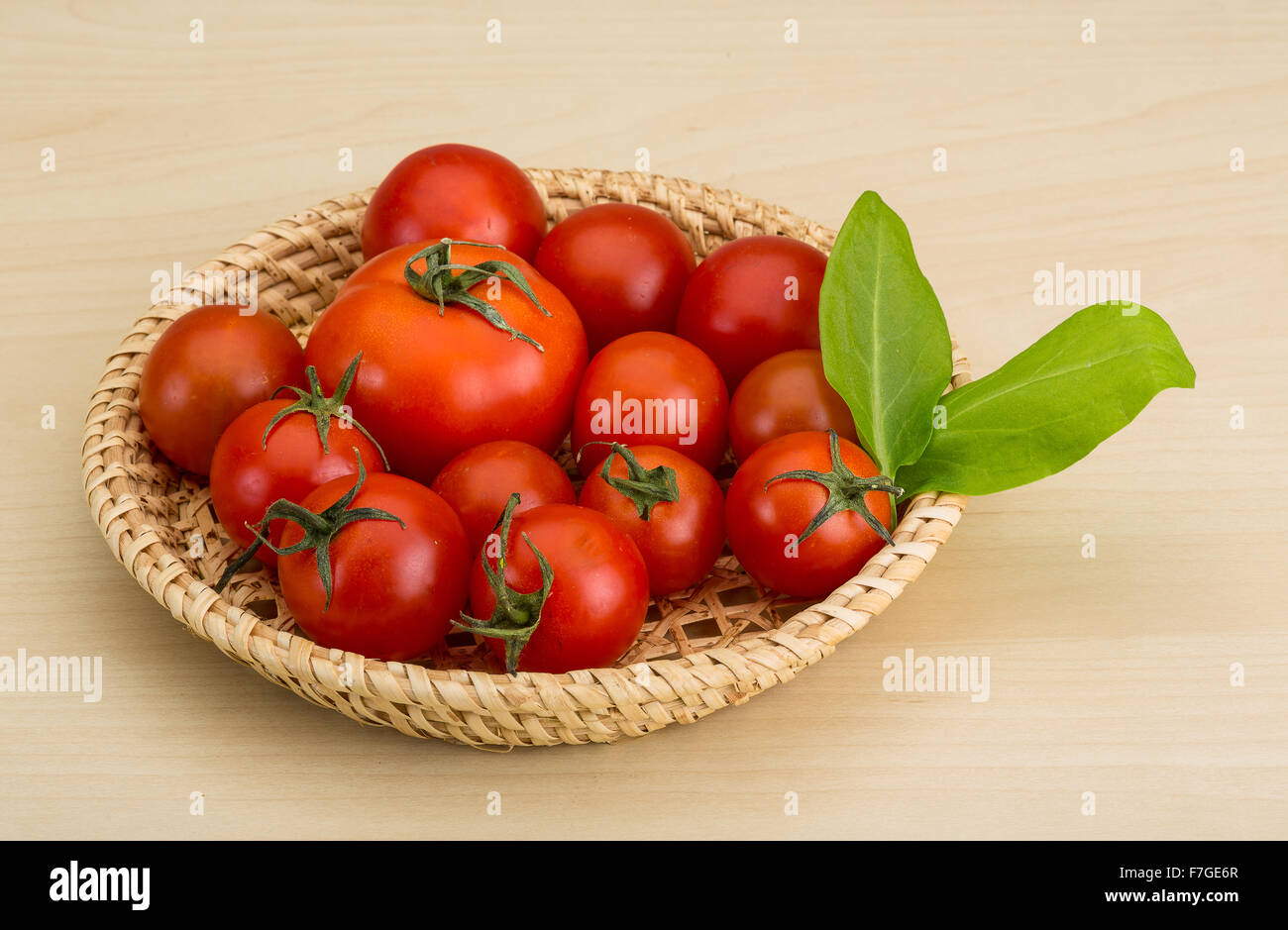 Fresh ripe Cherry tomatoes in the basket Stock Photo - Alamy