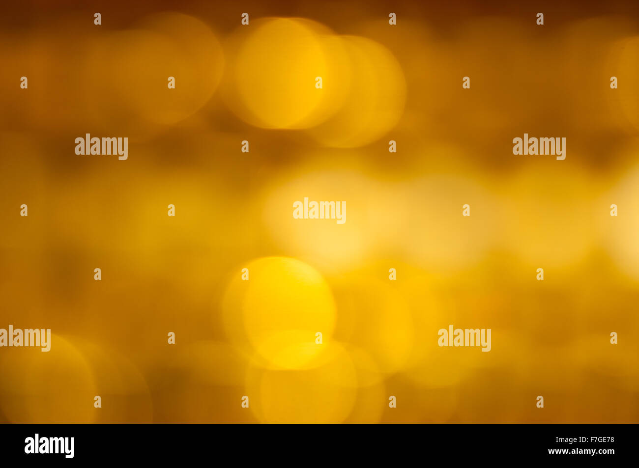 Golden background of blurred yellow and silver lights Stock Photo - Alamy