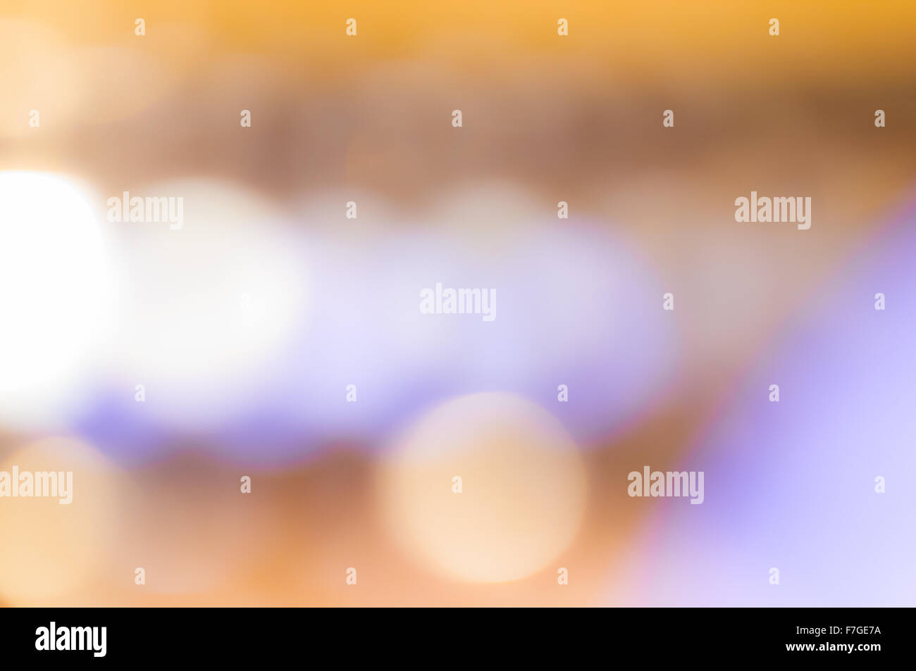 background of blurred yellow and purple lights Stock Photo