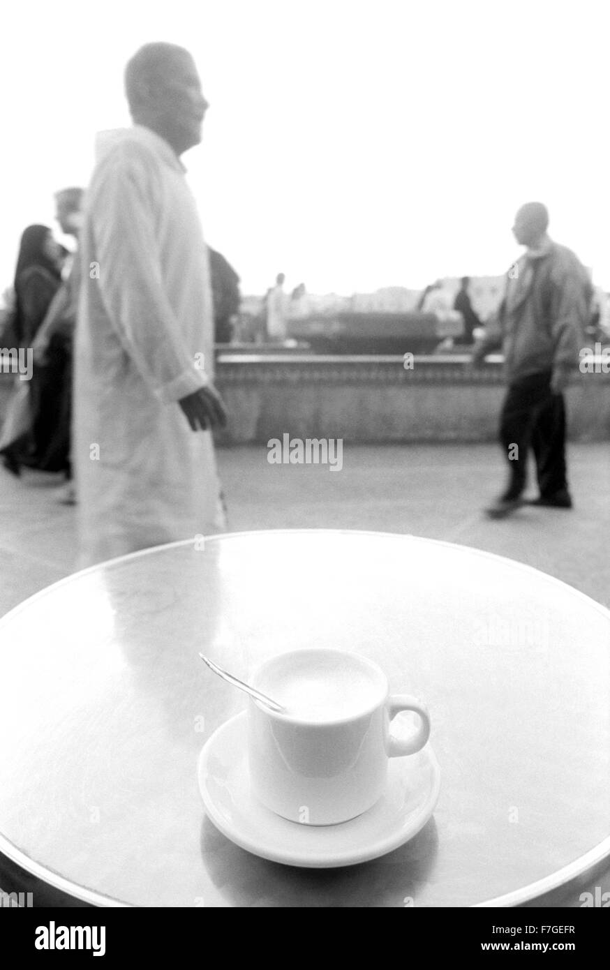 A hot cappuccino awaits a sip at a cafe in Marrakech, Morocco, North Africa. Stock Photo