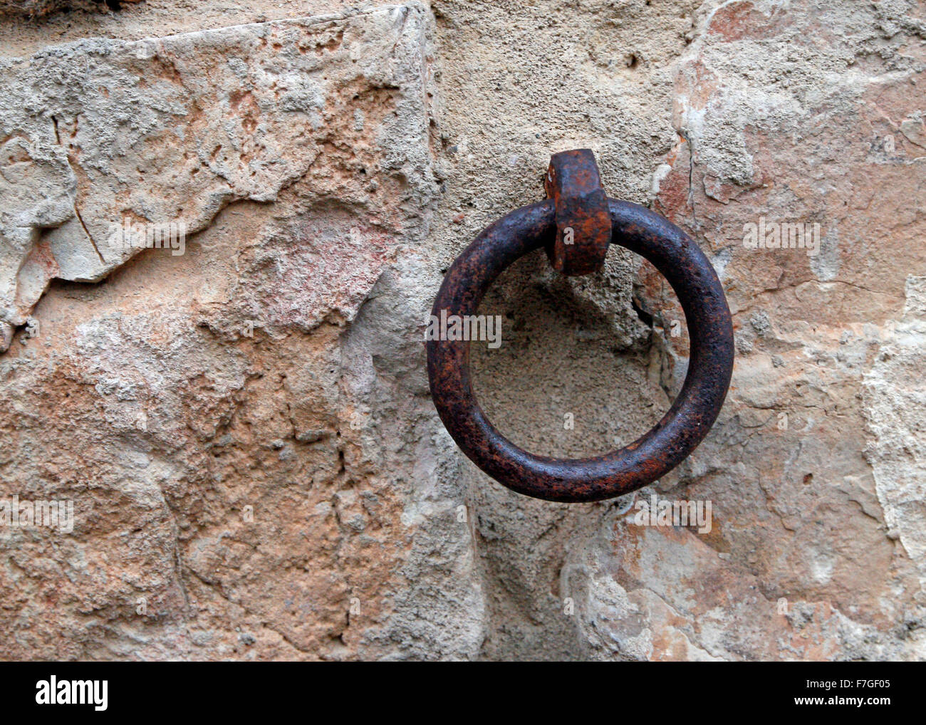 Old hitching ring on stone wall Stock Photo
