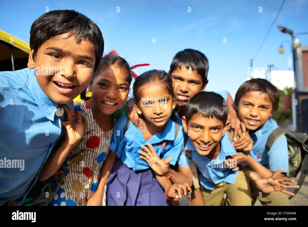 Portrait of india young smiling children coming back from school, street scene, Jodhpur, Rajasthan State, India Stock Photo