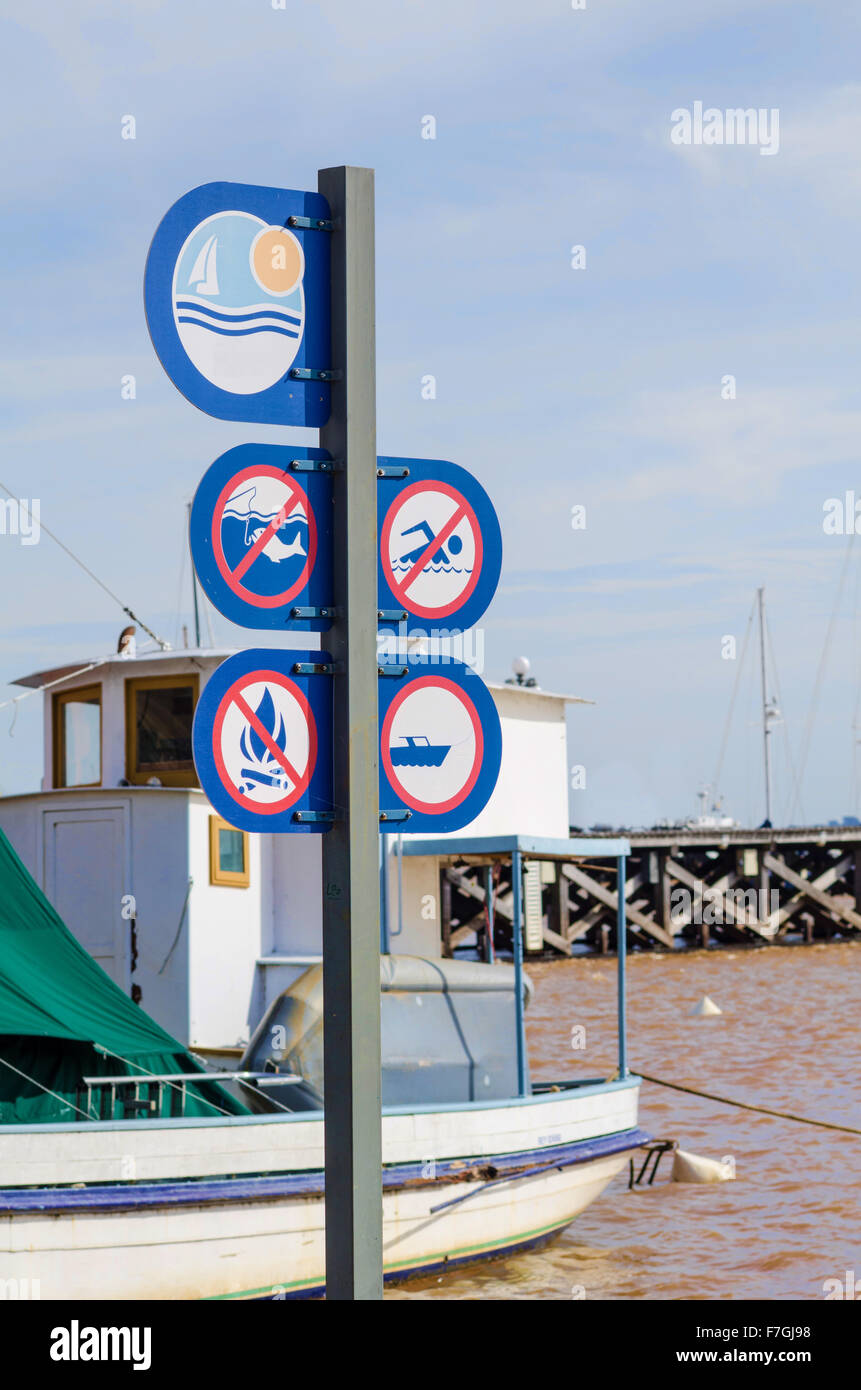 Signpost with safety instructions on a harbor pier Stock Photo - Alamy