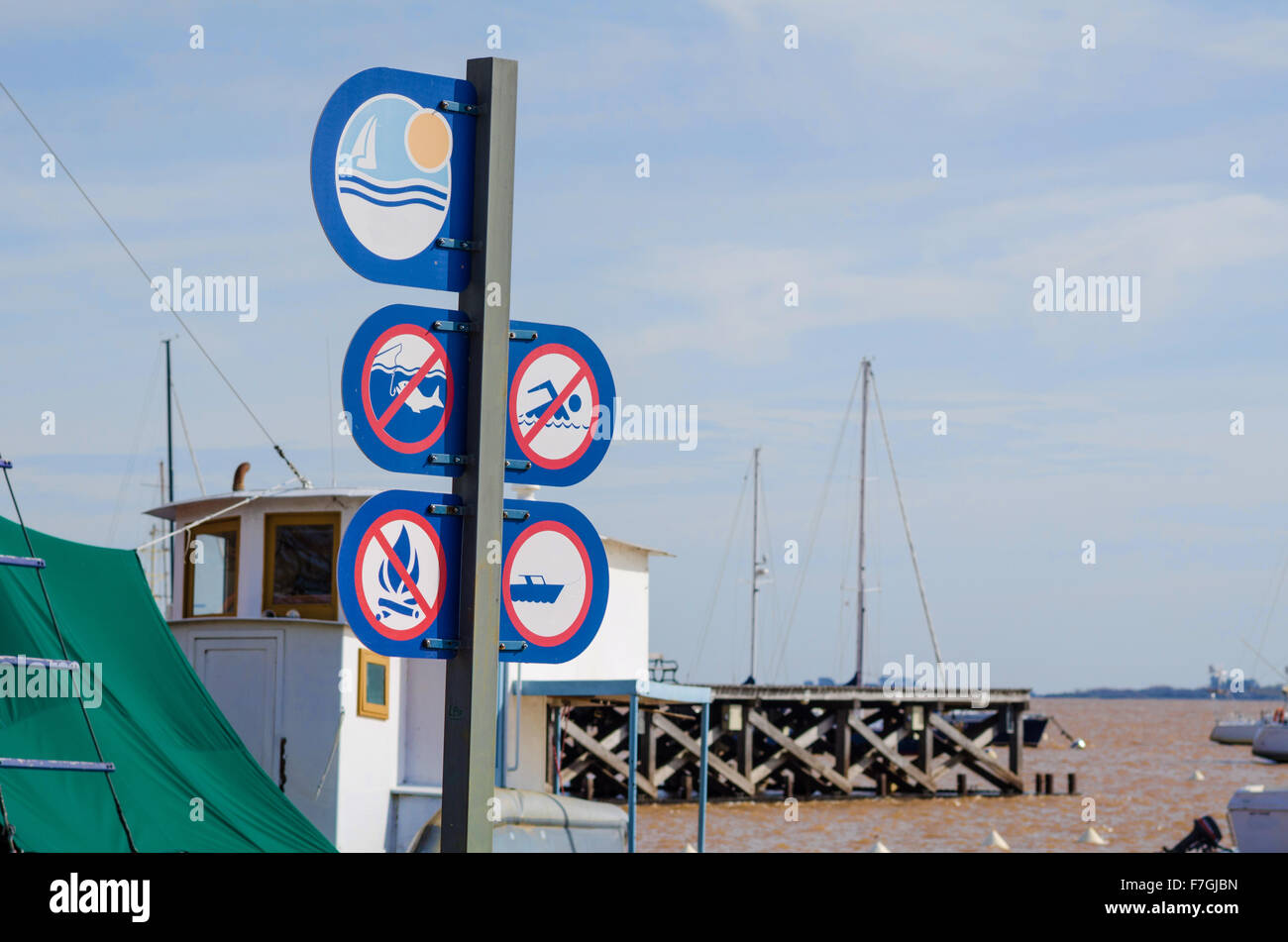Signpost with safety instructions on a harbor pier Stock Photo - Alamy