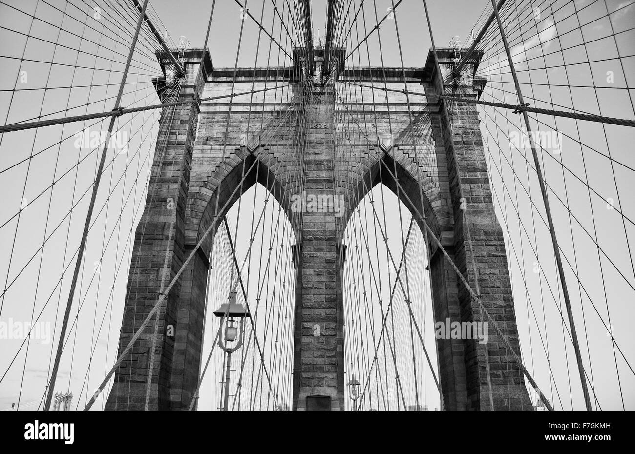 The Brooklyn Bridge is one of the oldest suspension bridges in the United States. Black and white shot Stock Photo