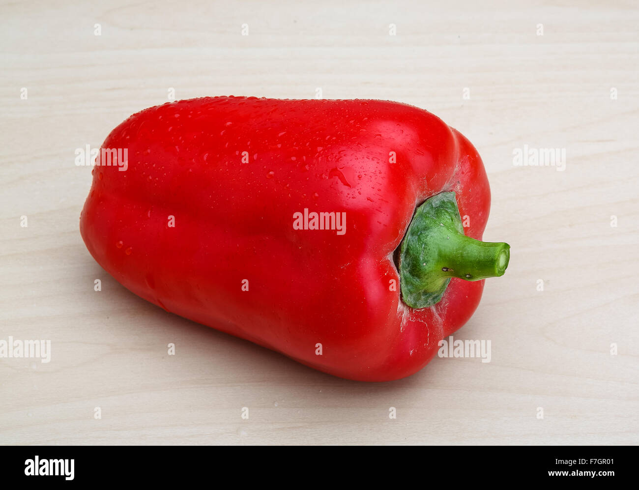 Red fresh bell pepper on the wood background Stock Photo - Alamy