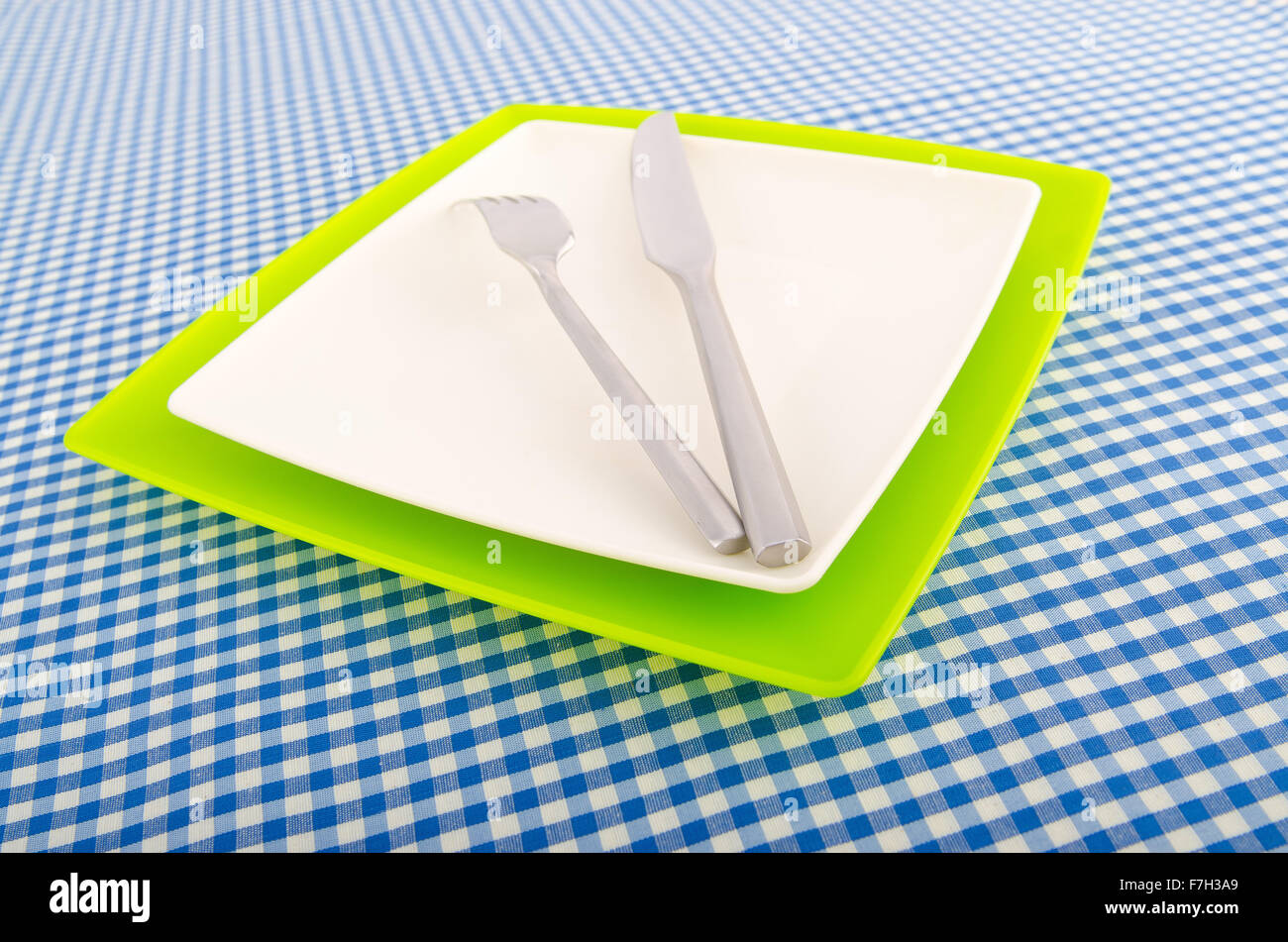 Served table with fork and knife Stock Photo - Alamy