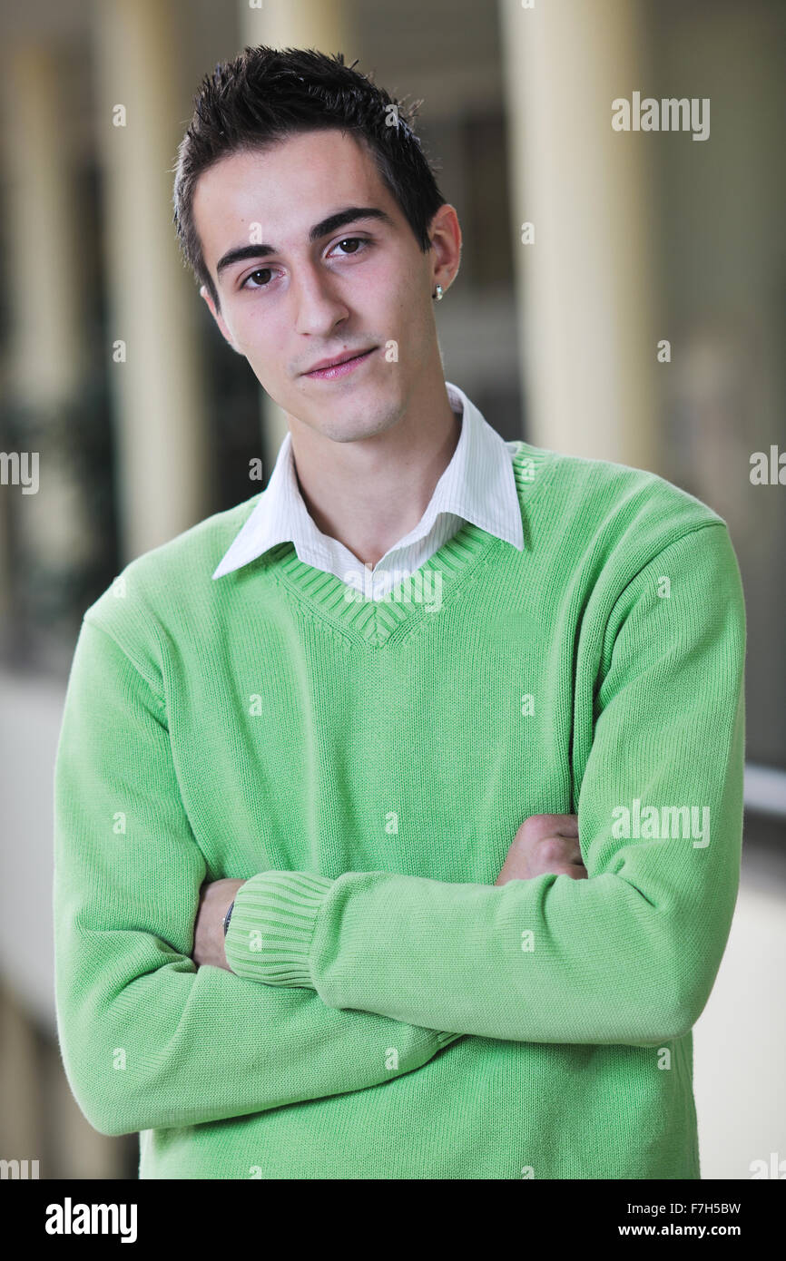 happy young student boy possing at university campus and reopresenting ...