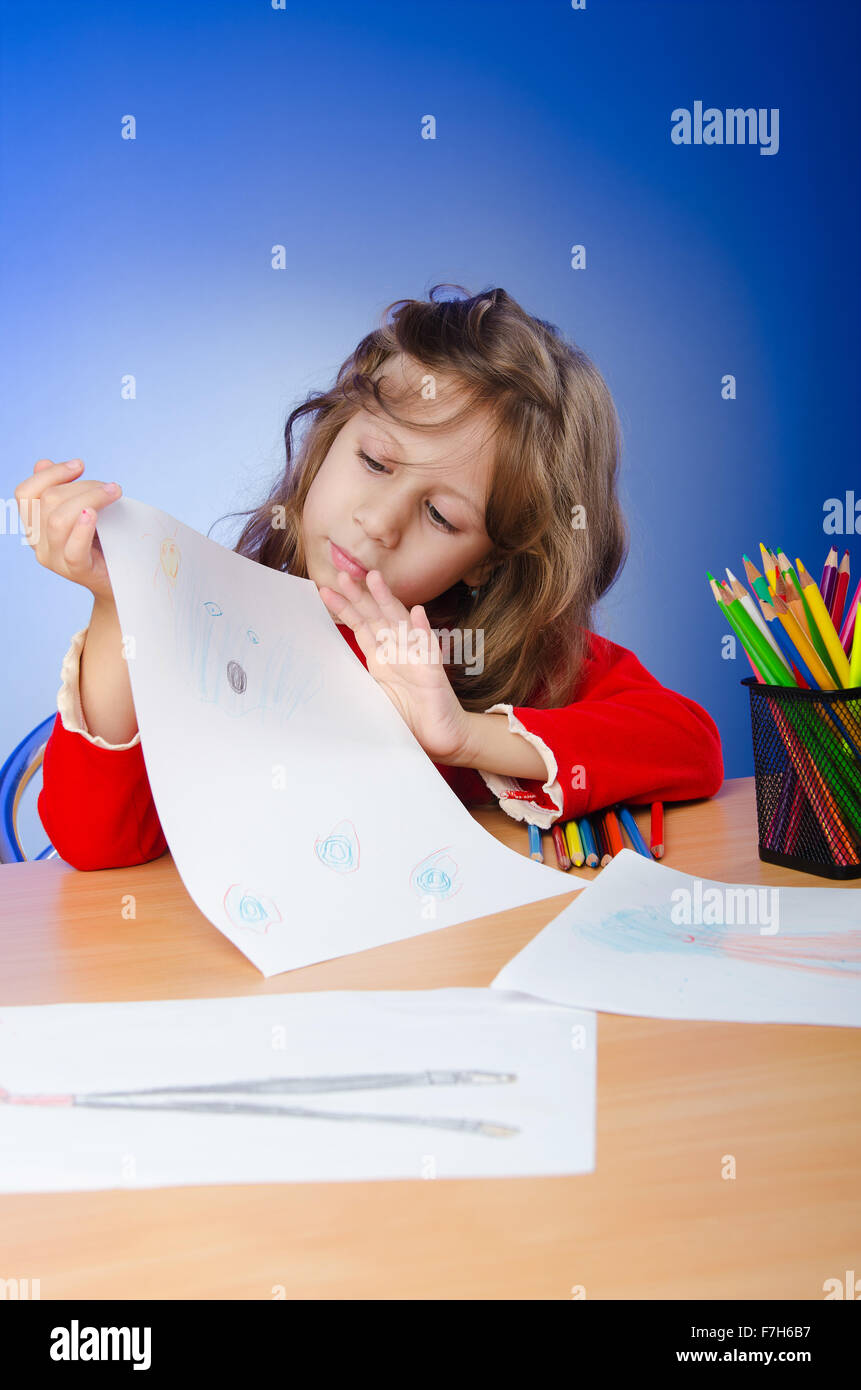 Little girl drawing with pencils Stock Photo - Alamy