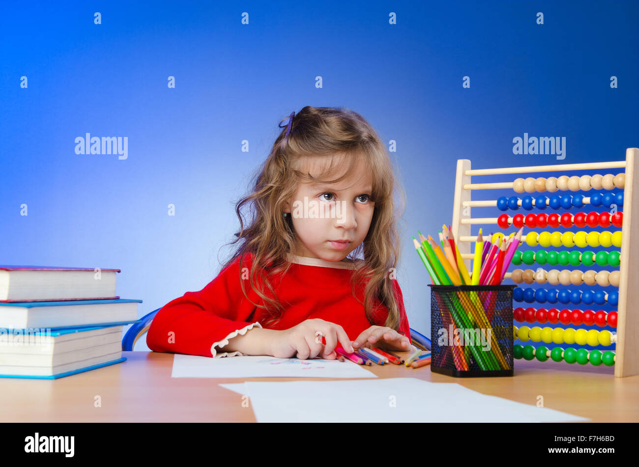 Little girl drawing with pencils Stock Photo - Alamy
