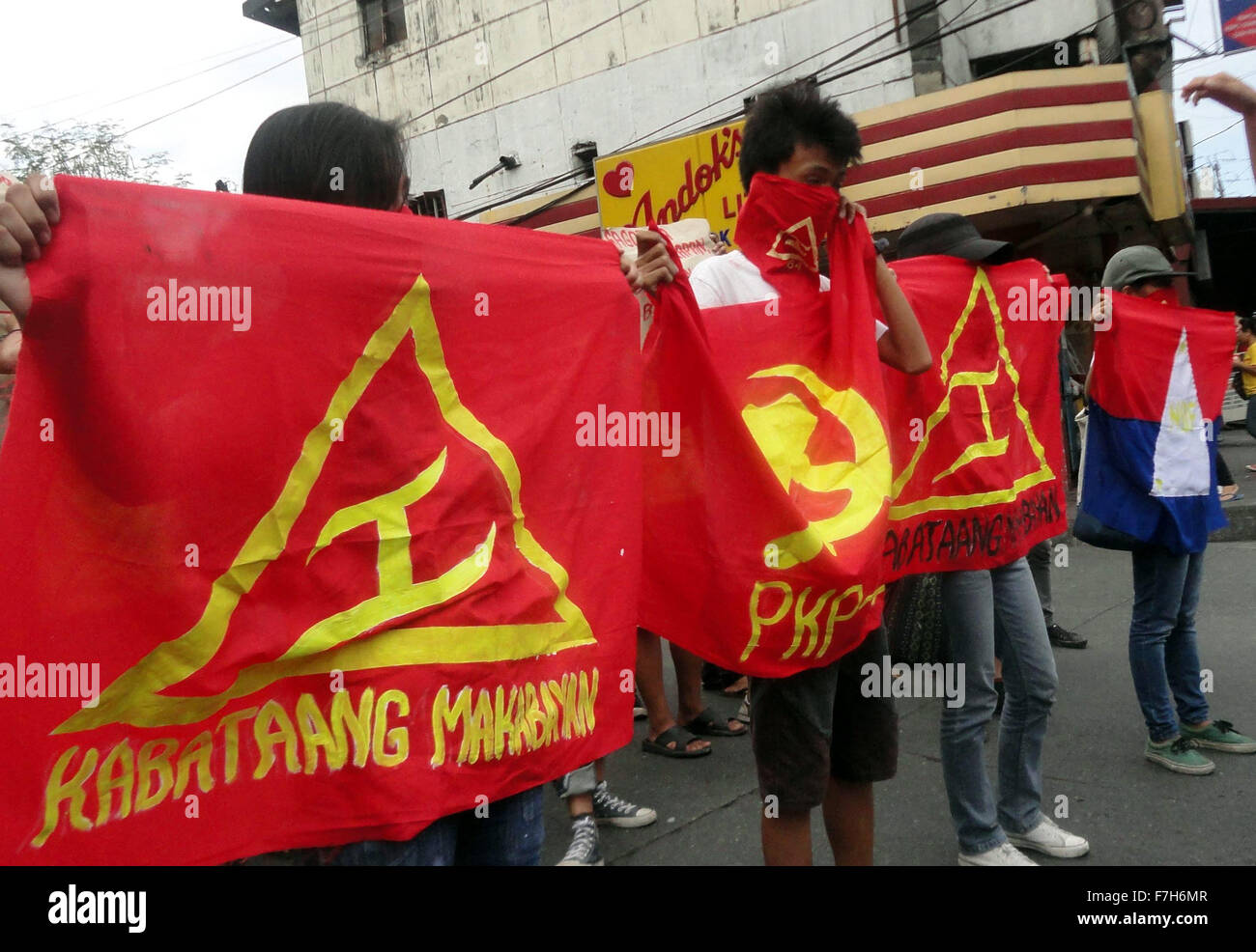Filipino activists from the communist youth group Kabataang Makabayan (Patriotic Youth) hold flags and placards as they shout slogans during a 'lightning rally' in Caloocan City. The group held the 'lightning rally' to protest the intervention of the United States in the Philippines. The communist youth group is a member-organization of the outlawed National Democratic Front of the Philippines (NDFP), which is waging an armed rebellion against the Philippine government along with the Communist Party of the Philippines (CPP-MLM) and the New People's Army (NPA). (Photo by Richard James Mendoza / Stock Photo