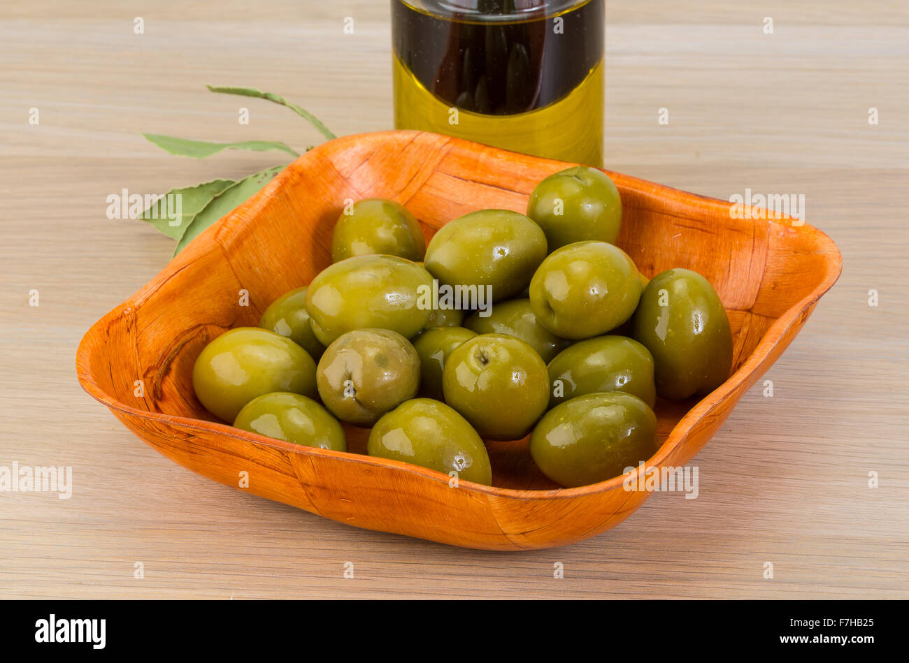 Green olives in the bowl with thyme branch Stock Photo Alamy