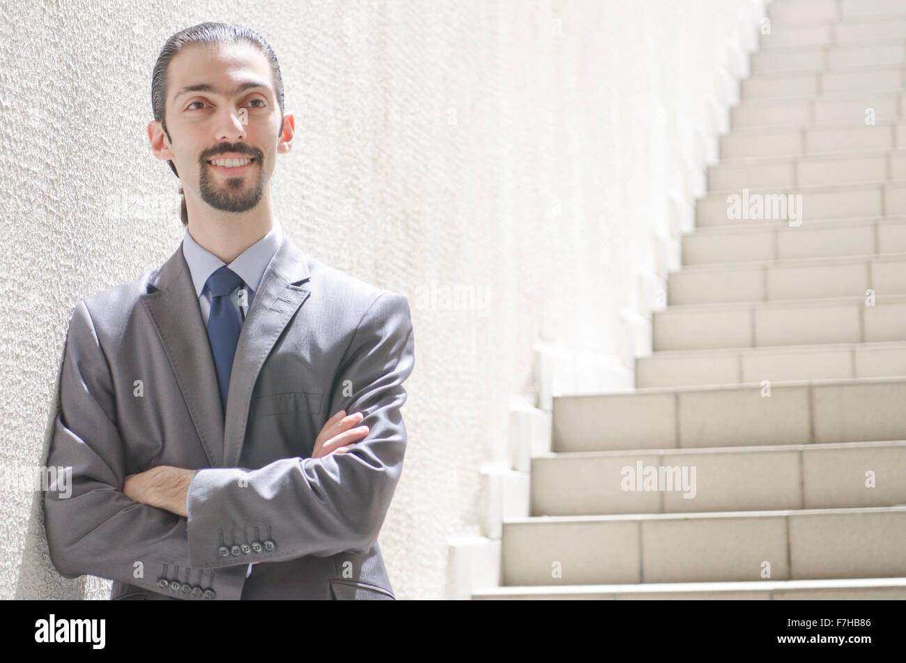 Businessman running up stairway hi-res stock photography and images - Alamy