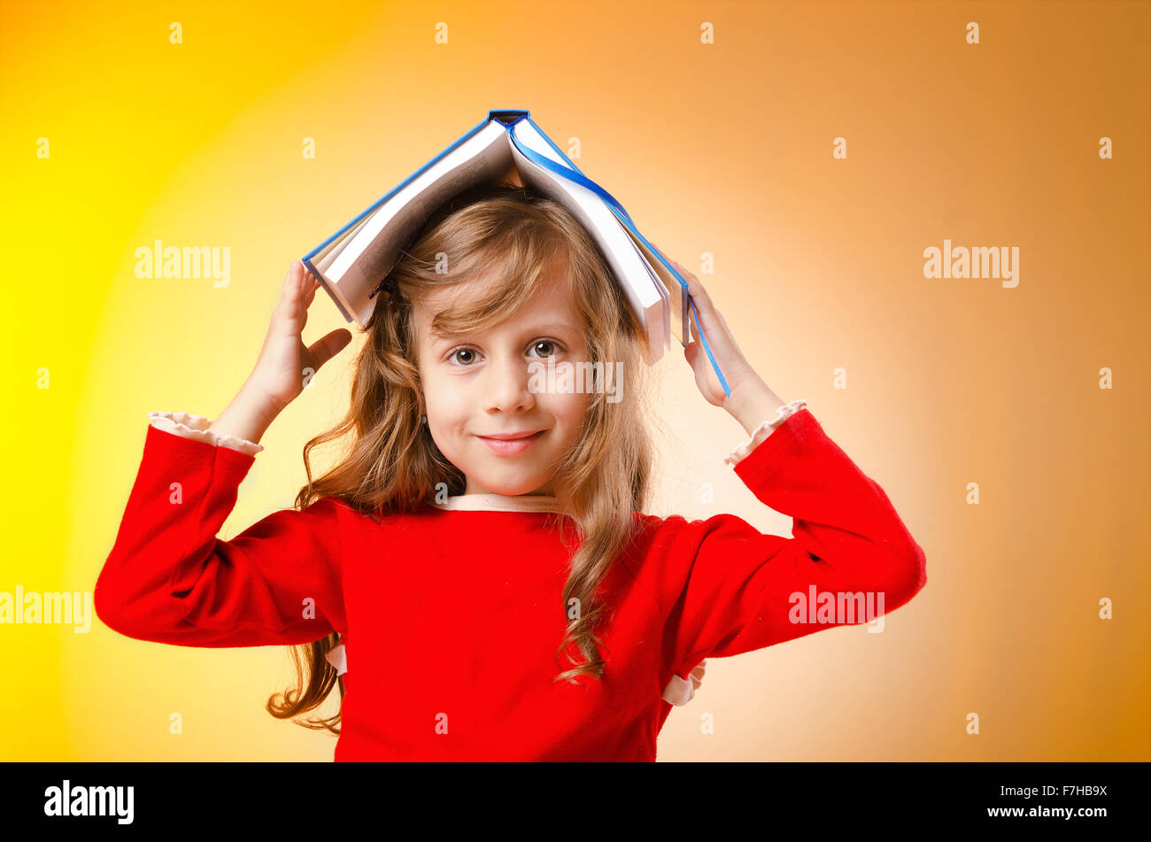 Little girl with books on white Stock Photo - Alamy