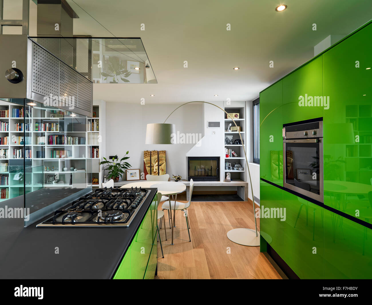 Green Kitchen With Kitchen Island In The Attic Room With Wood Floor And Fireplace Stock Photo Alamy