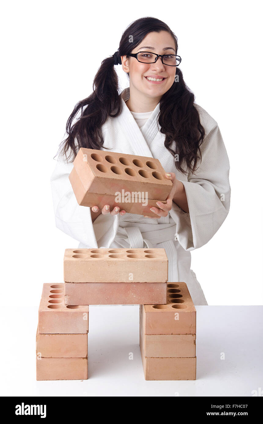 Woman karate breaking bricks on white Stock Photo Alamy