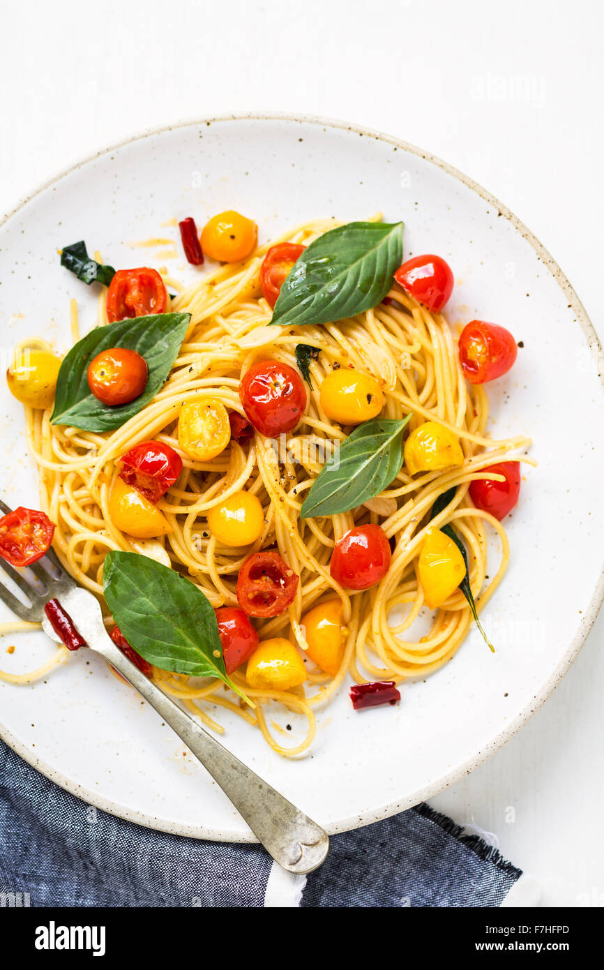 Spaghetti with red and yellow cherry tomato Stock Photo