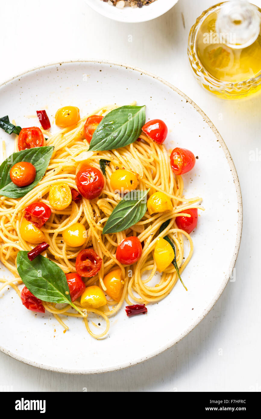Spaghetti with red and yellow cherry tomato by sea salt and olive oil Stock Photo