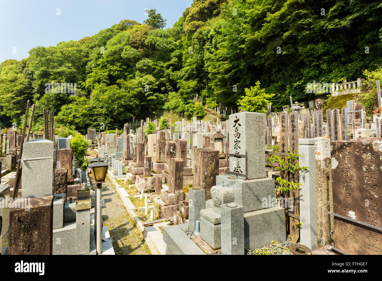 Old graves and headstones of the deceased at a Buddhist cemetery upstairs and behind Chion-In temple in ancient Kyoto, Japan. Ho Stock Photo