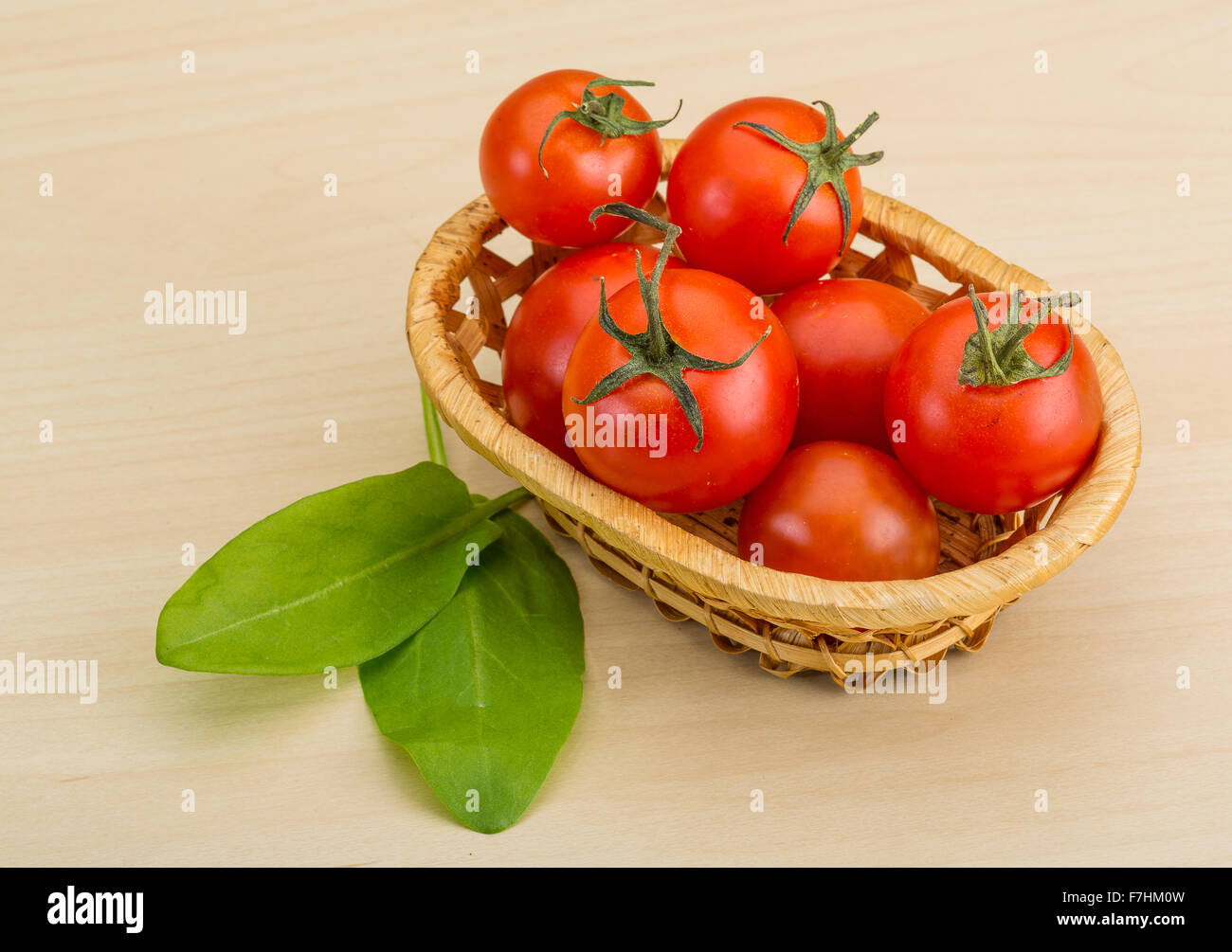 Fresh ripe Cherry tomatoes in the basket Stock Photo - Alamy
