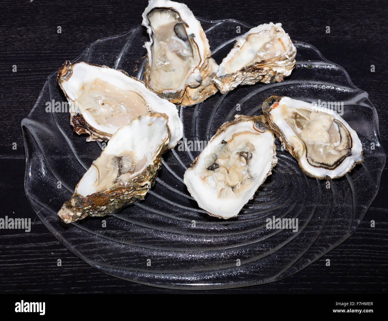 A dish of fresh oysters with lemon Stock Photo Alamy