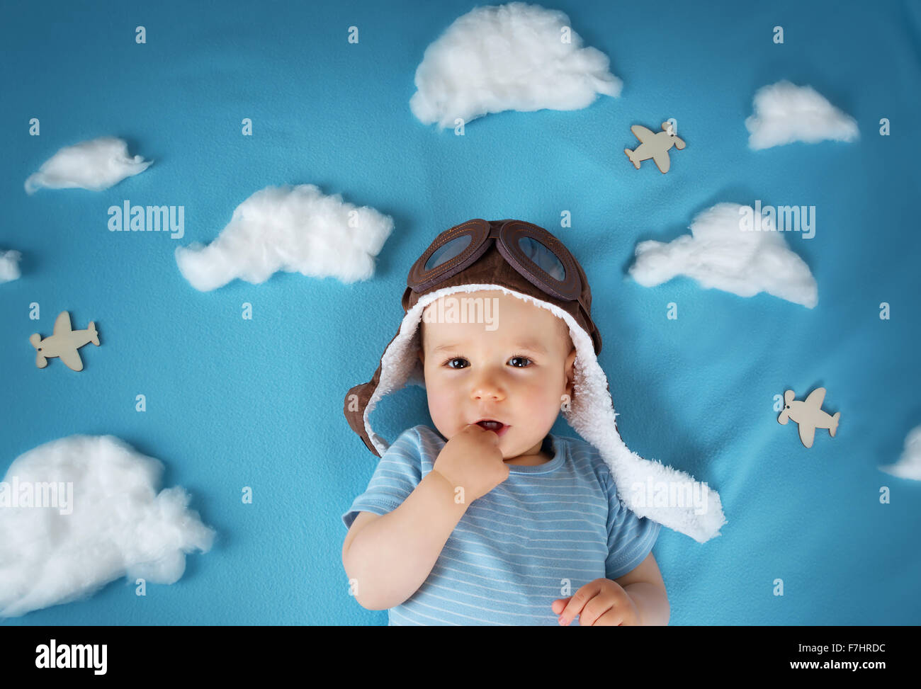boy lying on blanket with white clouds Stock Photo Alamy