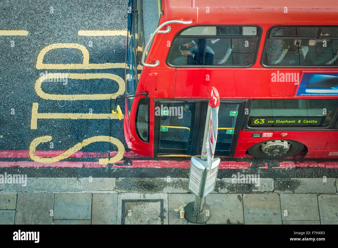 Red London Bus at bus stop viewed from above Stock Photo