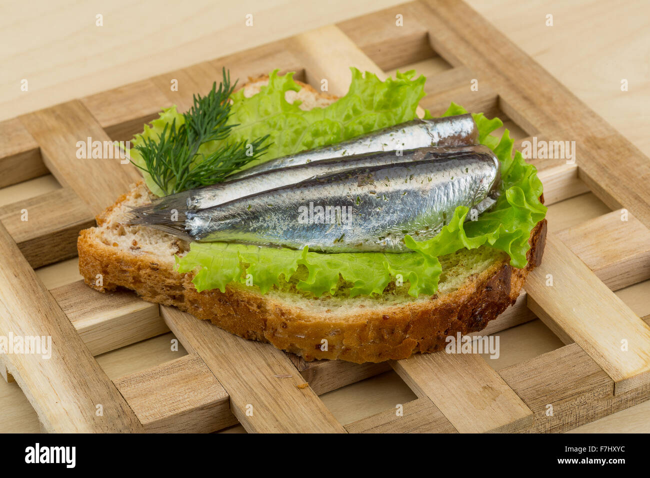 Anchovy tapas with salad leaves and dill Stock Photo - Alamy