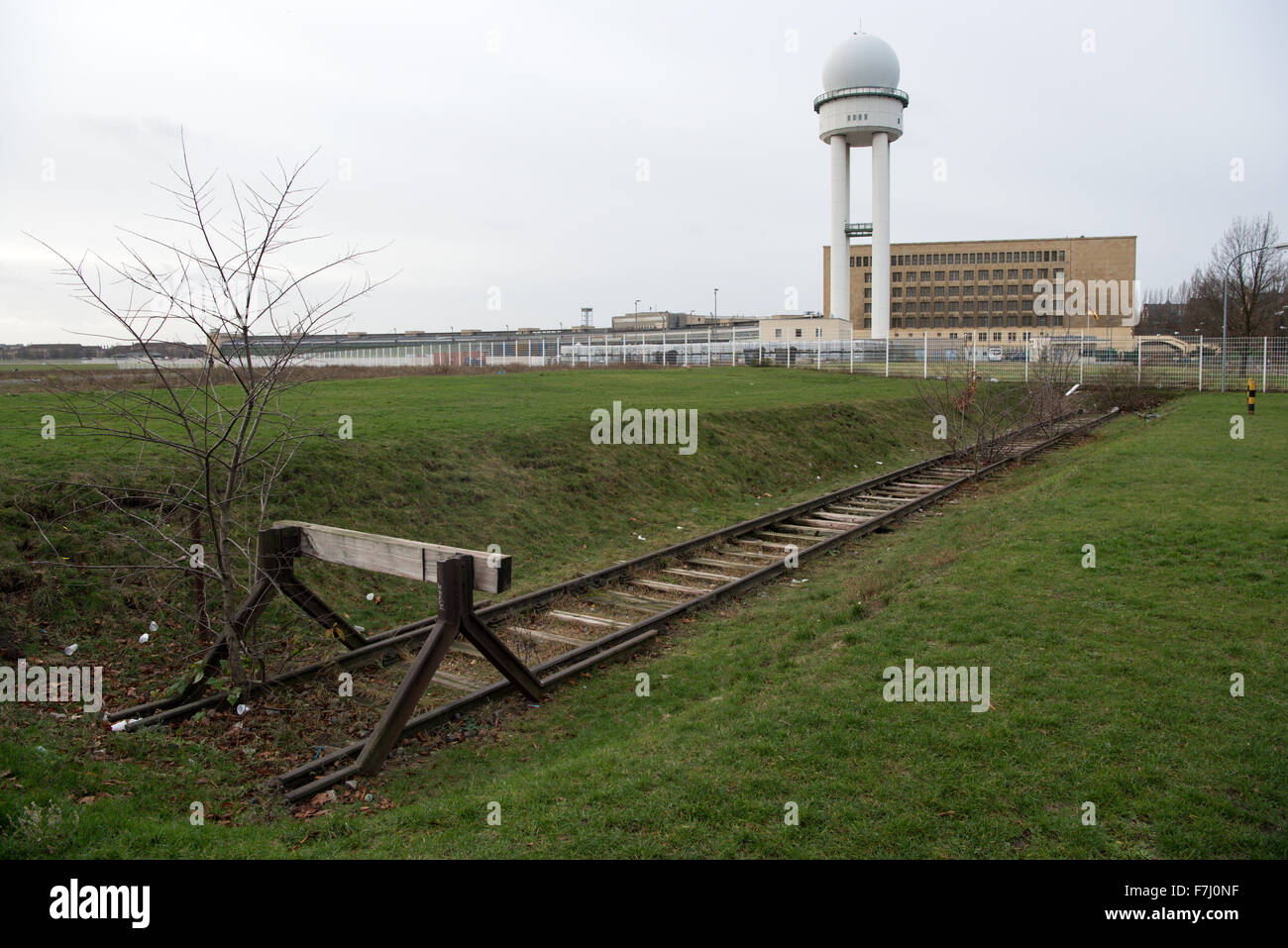 Berlin, Germany. 30th Nov, 2015. Disused rail tracks at the airfield of the former Templehof Airport in Berlin, Germany, 30 November 2015. Around 2300 refugees are currently housed in three of the hangars of the former airport. Another three of the airport's seven hangars are to be occupied from mid-December 2015. By Christmas, almost 5000 people from Syria, Afghanistan, Pakistan and the former Yugoslavia will be housed there. PHOTO: BERND VON JUTRCZENKA/DPA/Alamy Live News Stock Photo